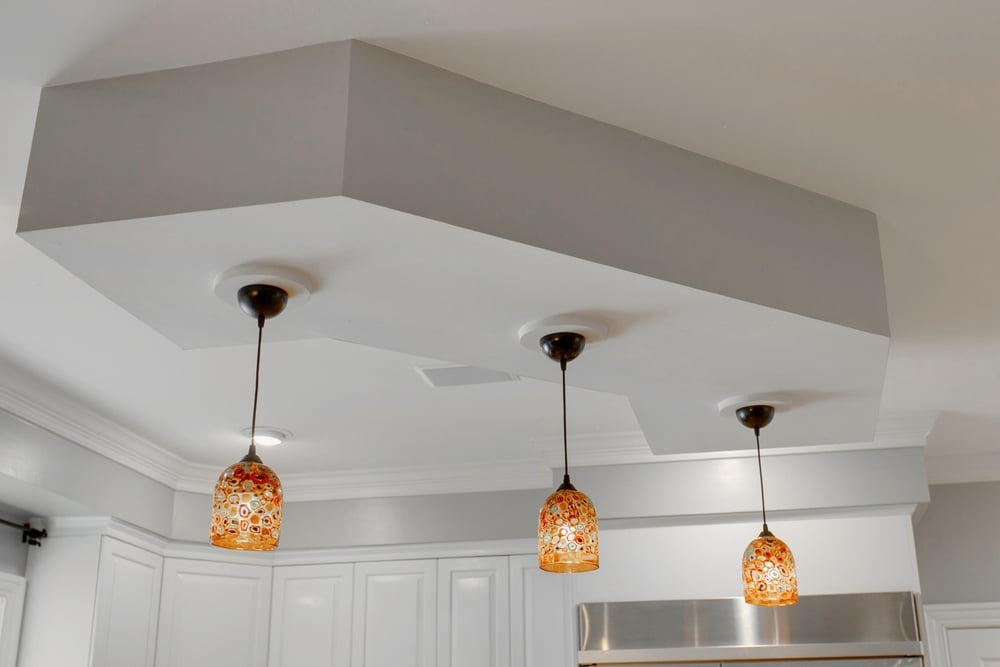 Modern,Kitchen,With,Trio,Of,Pendant,Lights,Hanging,From,Stylish - Tru-Craft Electric Corporation install lighting fixtures in the home